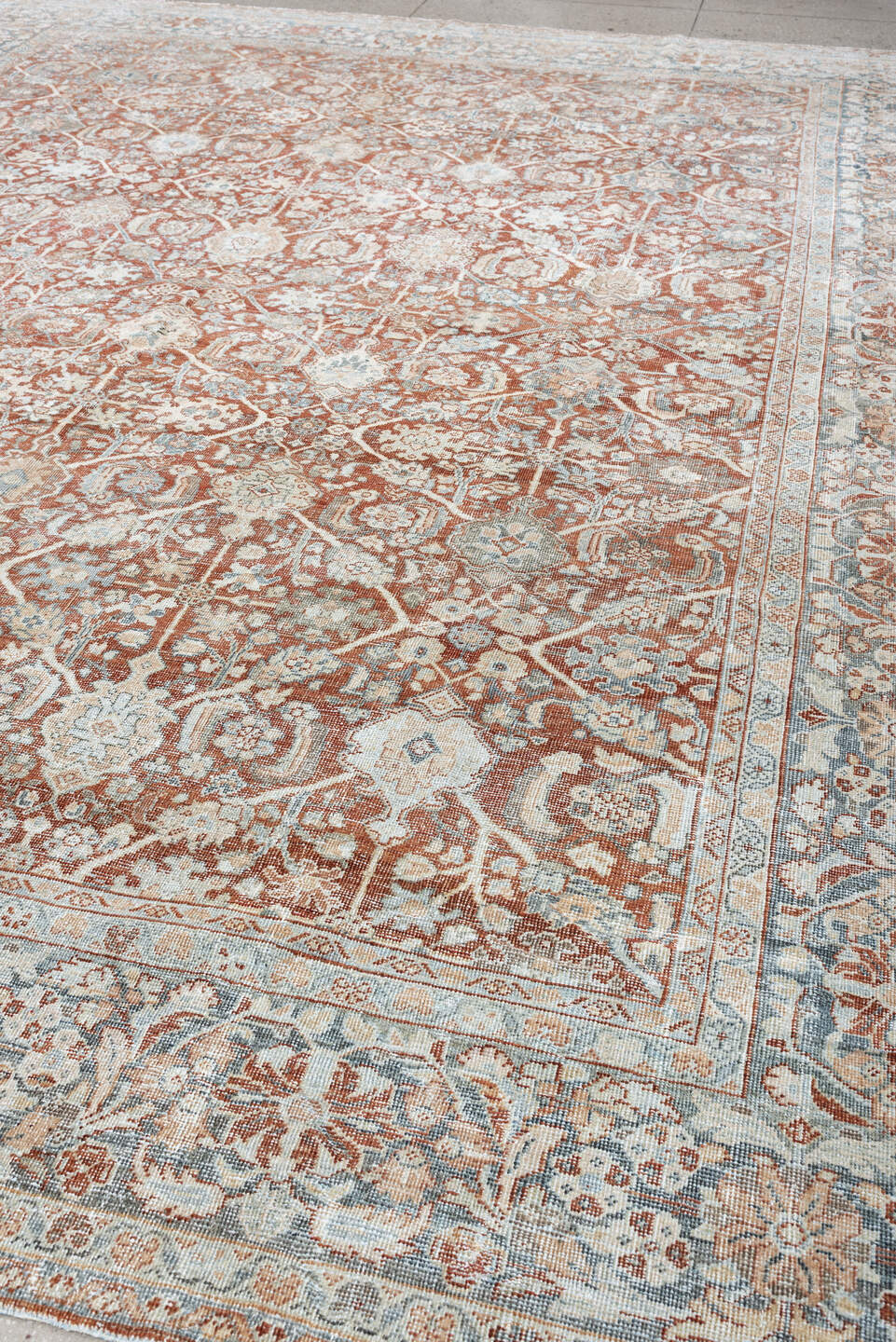 10' x 13' one-of-a-kind handmade vintage Mahal large size rug. Color palette: terracotta, pale blue, ivory, rust, taupe