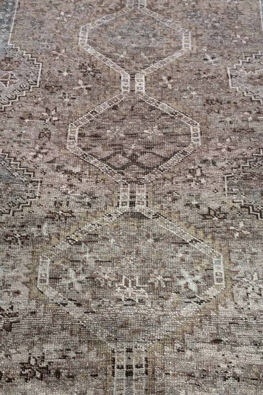 5' x 6' one-of-a-kind handmade antique Shiraz rug. Color palette: taupe, ivory, charcoal, blue gray, brown, slate, beige