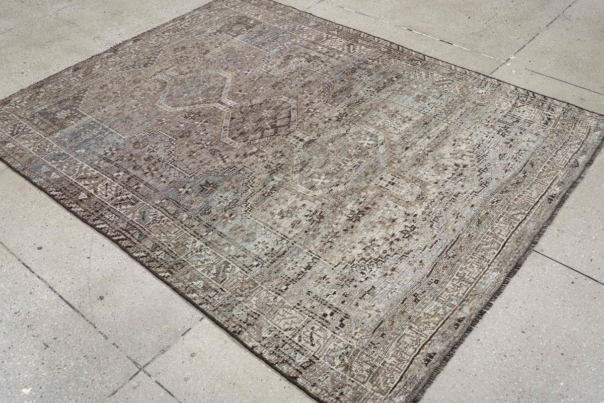 5' x 6' one-of-a-kind handmade antique Shiraz rug. Color palette: taupe, ivory, charcoal, blue gray, brown, slate, beige