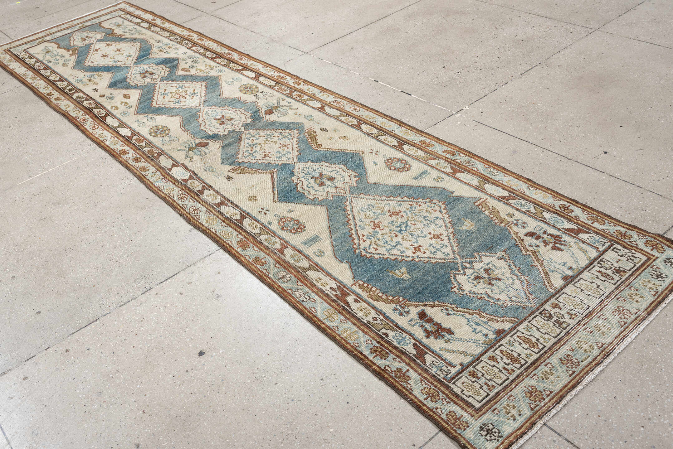 3' x 12' one-of-a-kind handmade antique NW Persian runner rug. Color palette: ivory, soft blue, rust, camel, taupe, sage