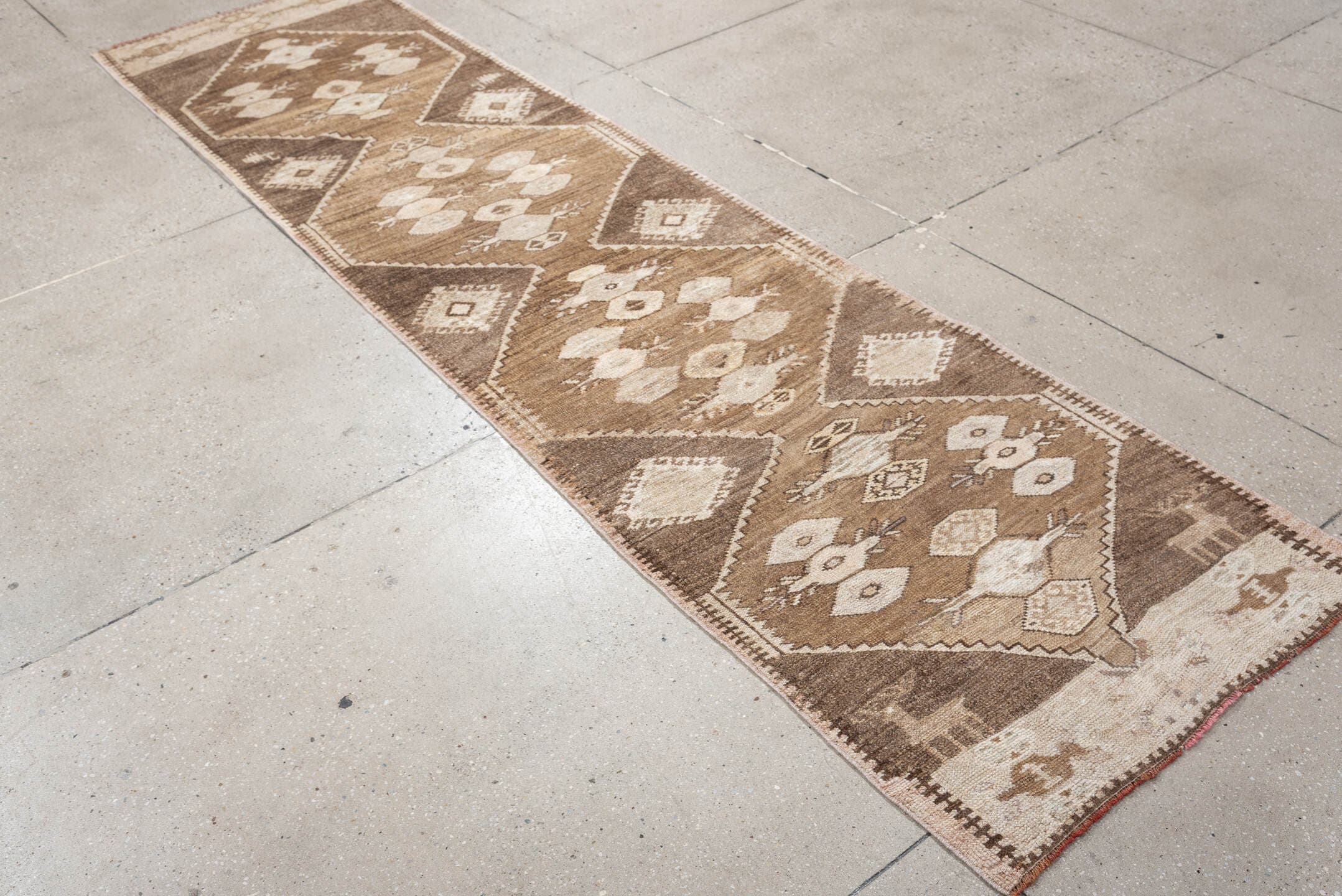 2' x 10' one-of-a-kind handmade antique Kars runner rug. Color palette: taupe, camel, brown, ivory, cream, beige, gray