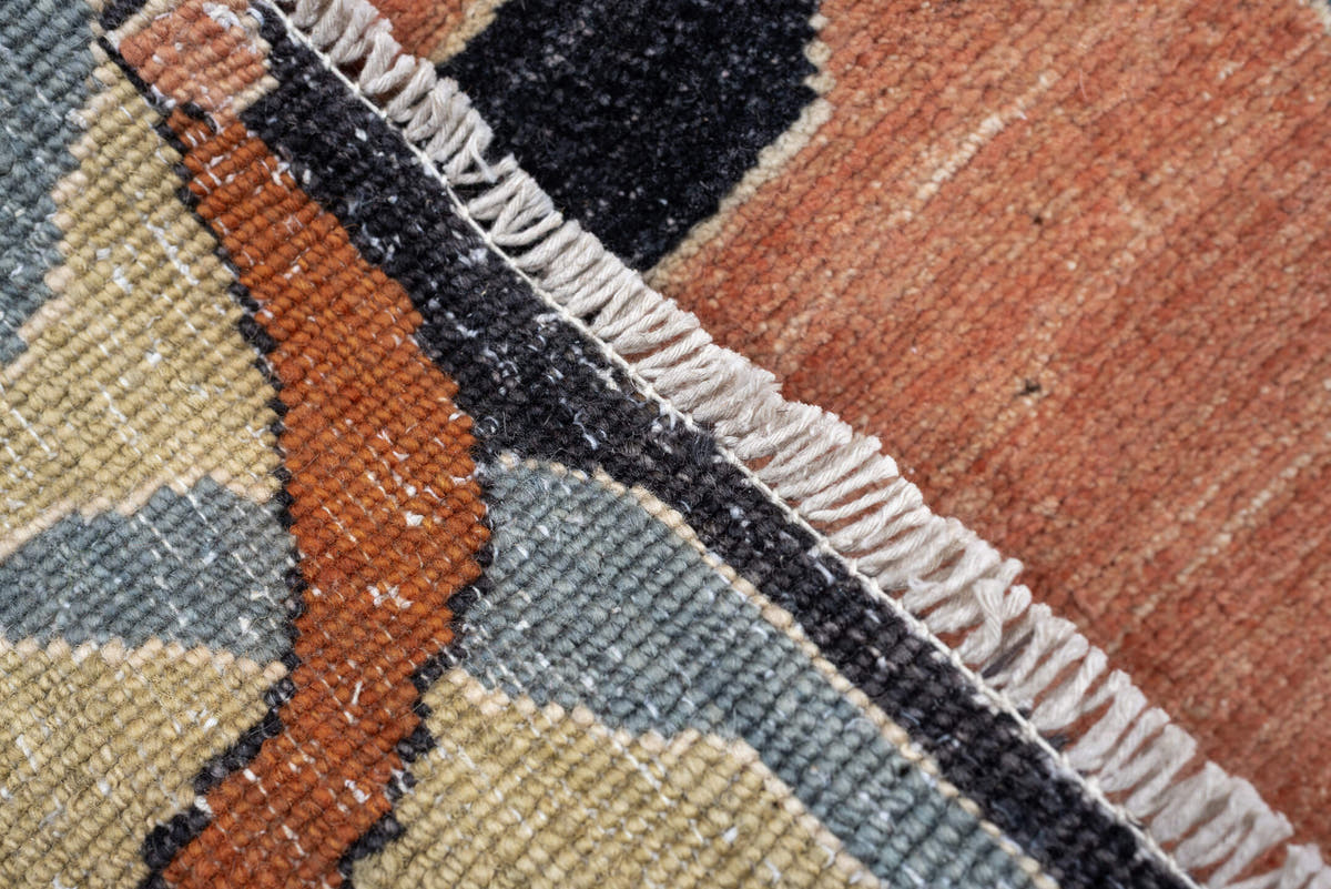 9' x 12' one-of-a-kind handmade vintage Afghan large size rug. Color palette: sage, salmon pink, ivory, blue gray, navy