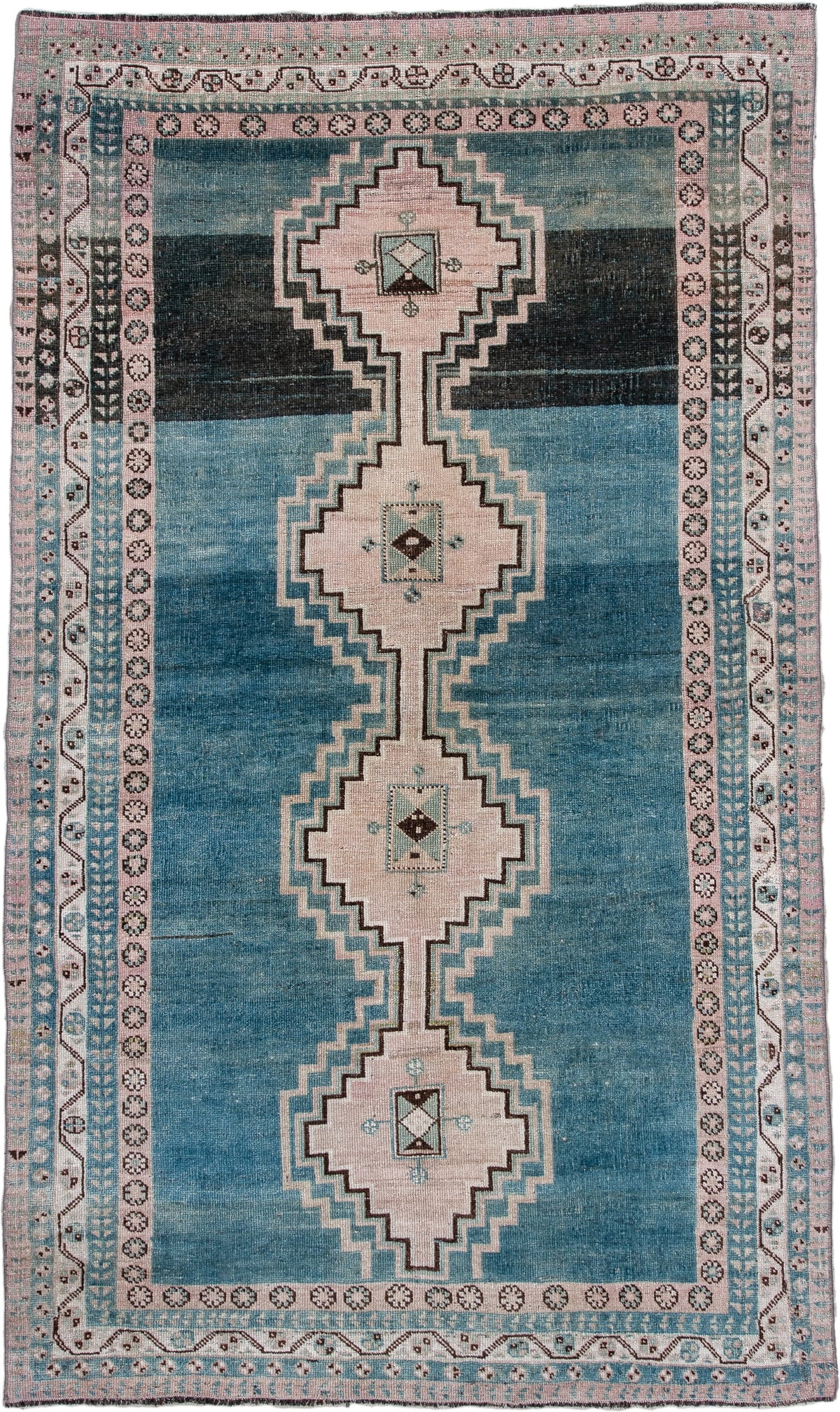4' x 7' one-of-a-kind handmade antique Shiraz rug. Color palette: teal blue, ivory, blush, charcoal, slate blue, dark brown