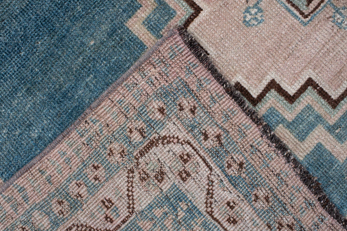 4' x 7' one-of-a-kind handmade antique Shiraz rug. Color palette: teal blue, ivory, blush, charcoal, slate blue, dark brown