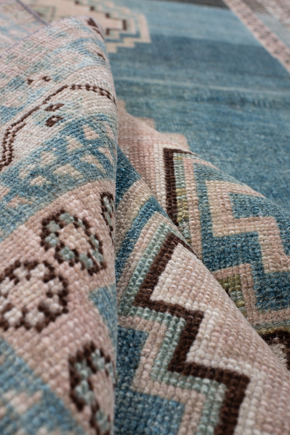 4' x 7' one-of-a-kind handmade antique Shiraz rug. Color palette: teal blue, ivory, blush, charcoal, slate blue, dark brown