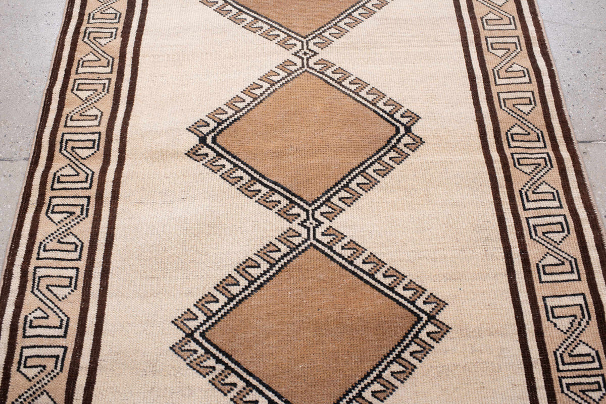 3' x 6' one-of-a-kind handmade antique Anatolian rug. Color palette: ivory, camel, dark brown, taupe, charcoal, beige, brown