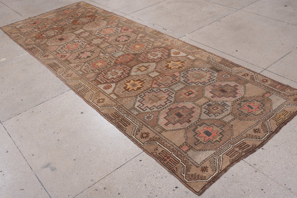 4' x 11' one-of-a-kind handmade antique Anatolian runner rug. Color palette: camel, taupe, rose, rust, charcoal, ivory