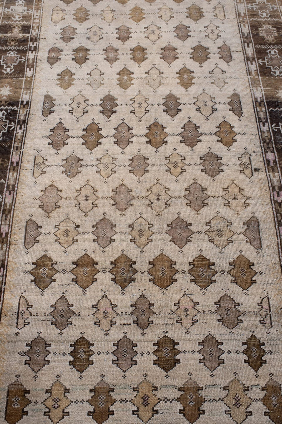 3' x 7' one-of-a-kind handmade antique Anatolian rug. Color palette: ivory, walnut brown, taupe, camel, charcoal, soft rose
