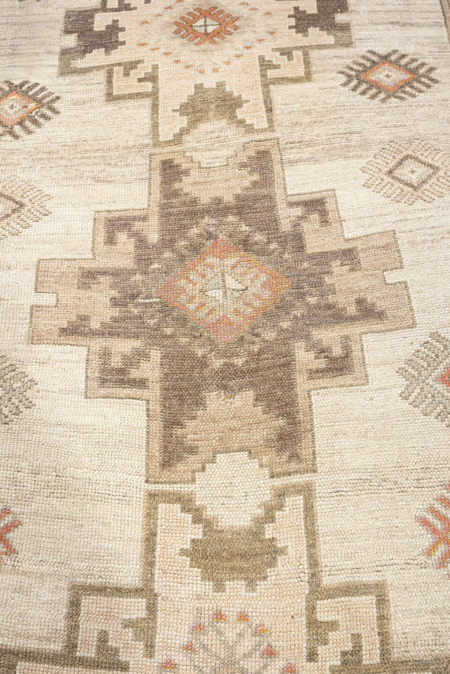 4' x 10' one-of-a-kind handmade antique Anatolian runner rug. Color palette: ivory, taupe, charcoal, camel, coral, rose