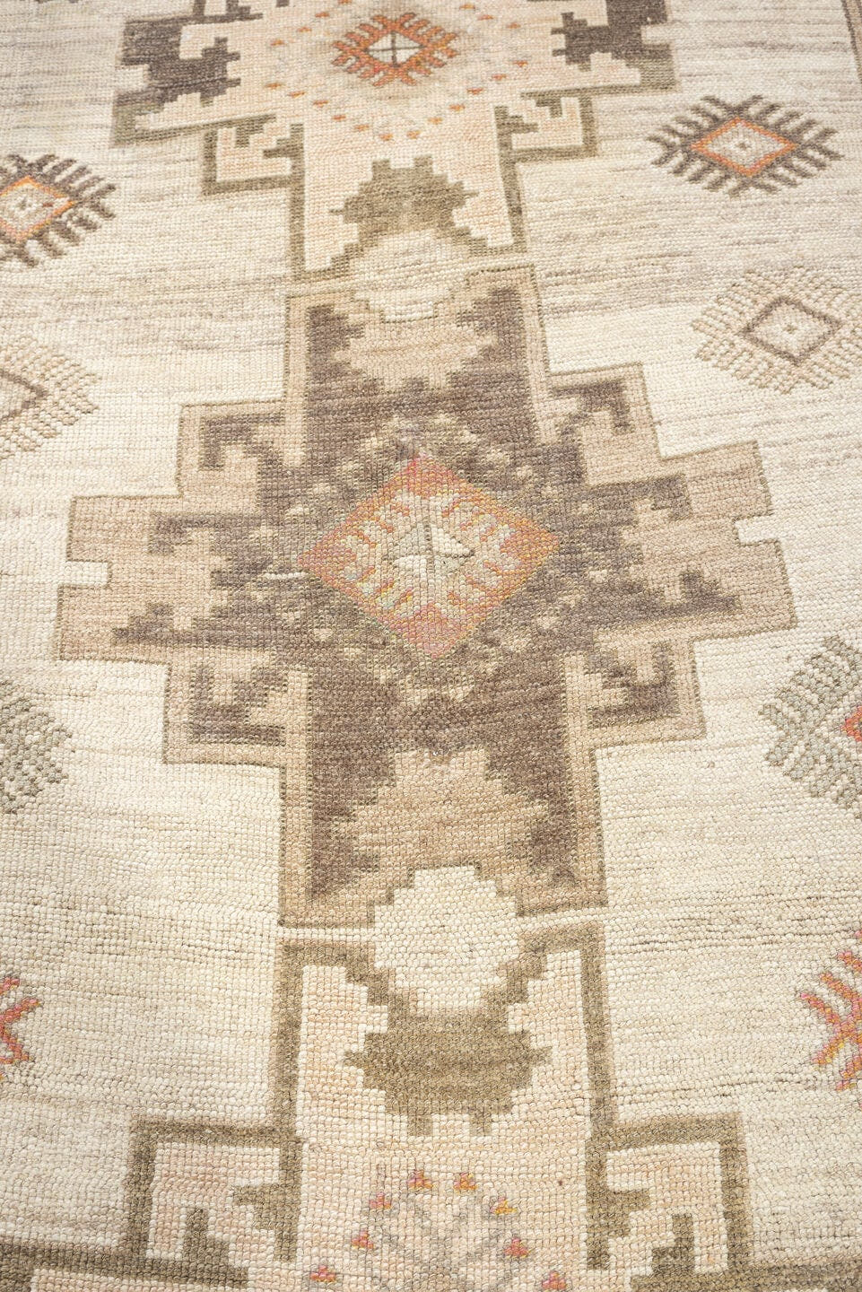 4' x 10' one-of-a-kind handmade antique Anatolian runner rug. Color palette: ivory, taupe, charcoal, camel, coral, rose
