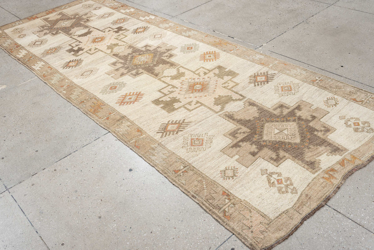 4' x 10' one-of-a-kind handmade antique Anatolian runner rug. Color palette: ivory, taupe, charcoal, camel, coral, rose