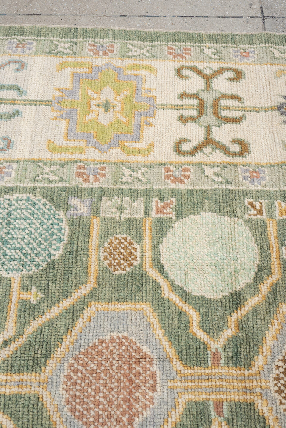 8' x 10' one-of-a-kind handmade antique Oushak large size rug. Color palette: sage, ivory, coral, gold, pale blue, charcoal