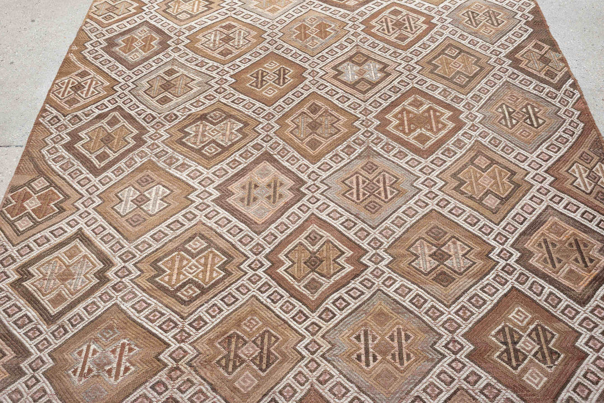 5' x 14' one-of-a-kind handmade antique Jijim rug. Color palette: taupe, ivory, camel, dusty rose, rust, brown, charcoal