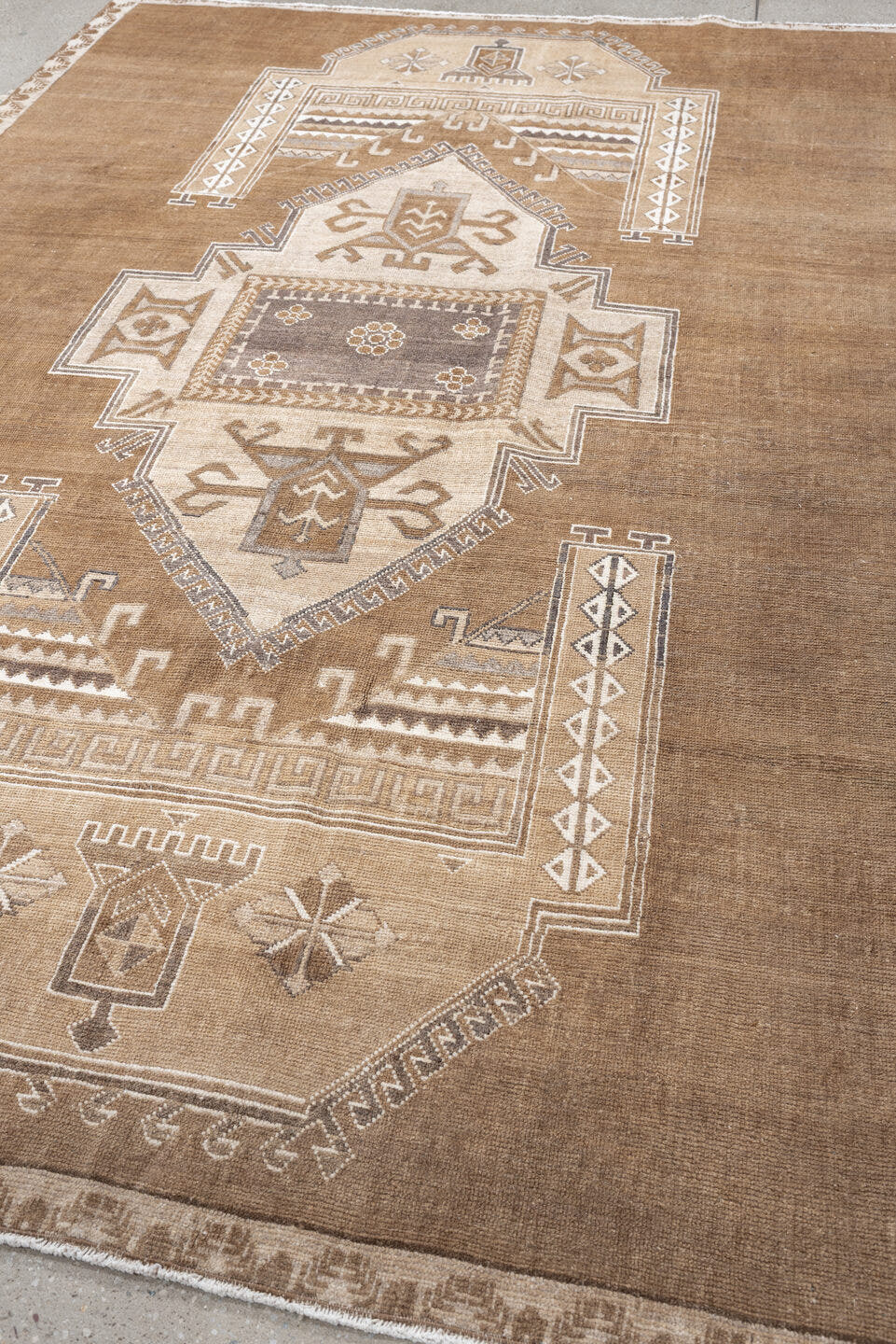 6' x 9' one-of-a-kind handmade antique Kars medium size rug. Color palette: camel, taupe, ivory, brown, charcoal, sand