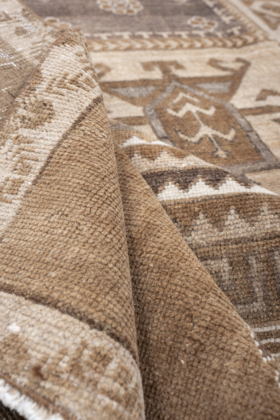 6' x 9' one-of-a-kind handmade antique Kars medium size rug. Color palette: camel, taupe, ivory, brown, charcoal, sand