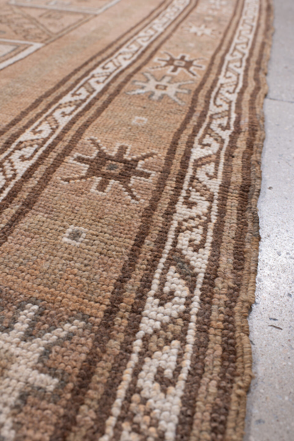 4' x 12' one-of-a-kind handmade antique Kars runner rug. Color palette: camel, taupe, ivory, brown, beige, charcoal, gray