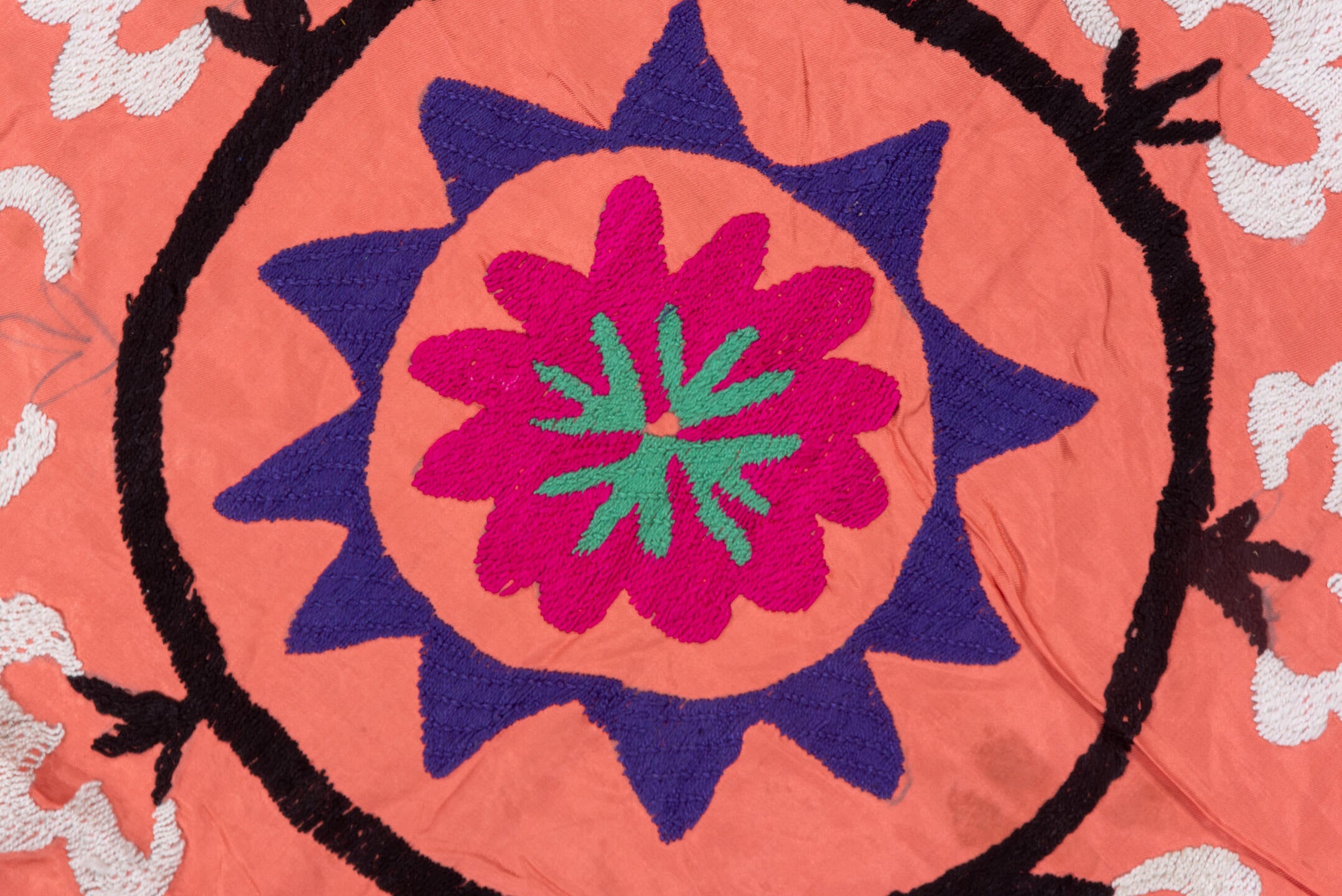 7' x 7' one-of-a-kind handmade vintage Suzani rug. Color palette: coral, black, teal, violet, white, gold, crimson