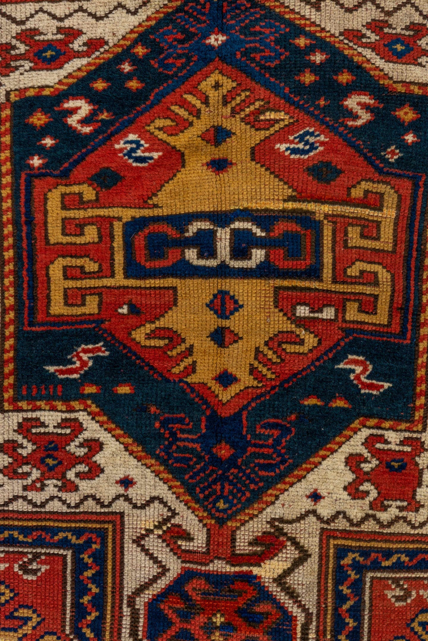 3' x 6' one-of-a-kind handmade vintage Kazak small size rug. Color palette: rust, ivory, navy, gold, crimson, camel, teal