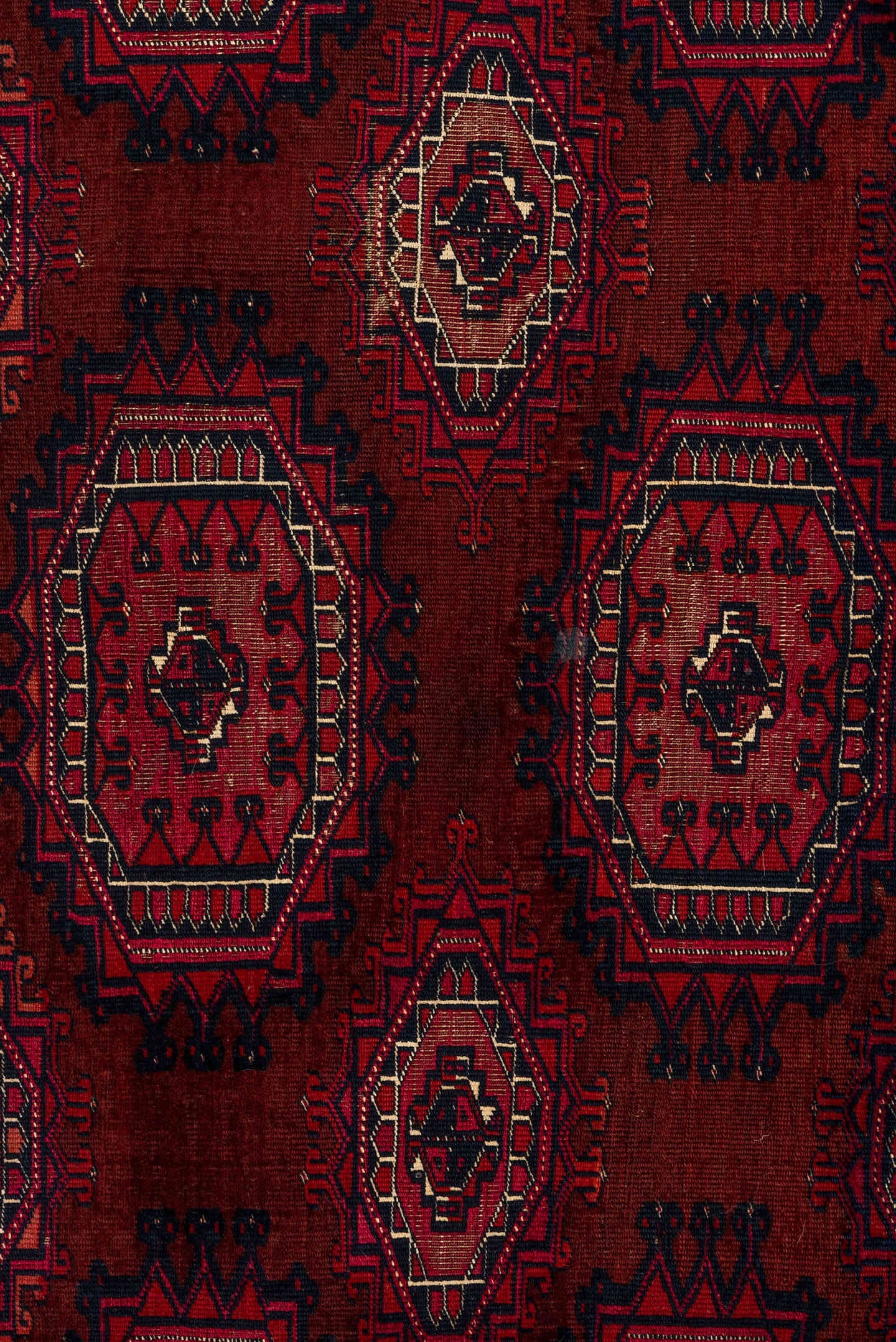 2' x 5' one-of-a-kind handmade vintage Teke small size rug. Color palette: burgundy, crimson, rust, ivory, charcoal, rose