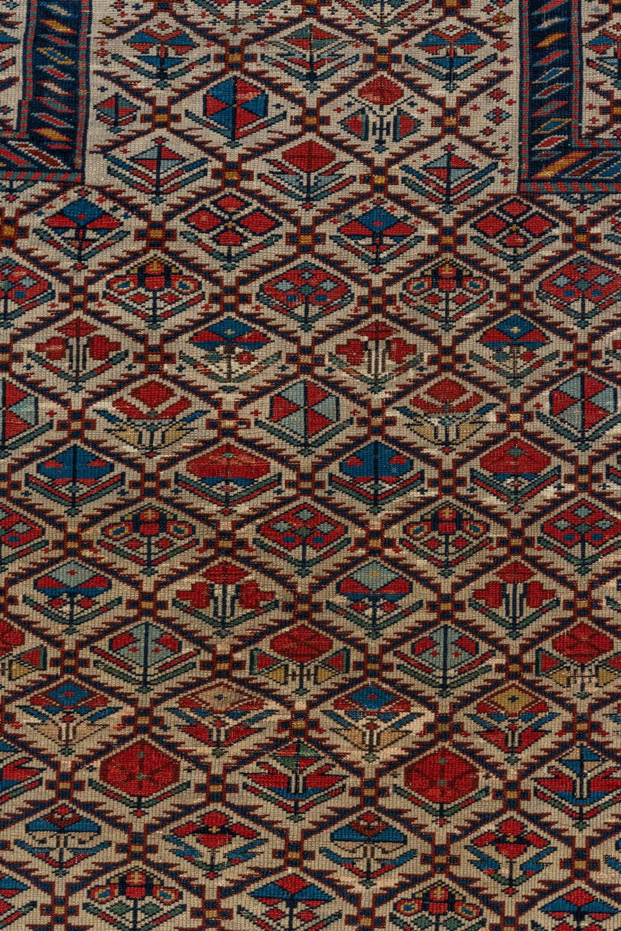 4' x 4' one-of-a-kind handmade vintage Shirvan small size rug. Color palette: ivory, navy, rust, sky blue, crimson, camel
