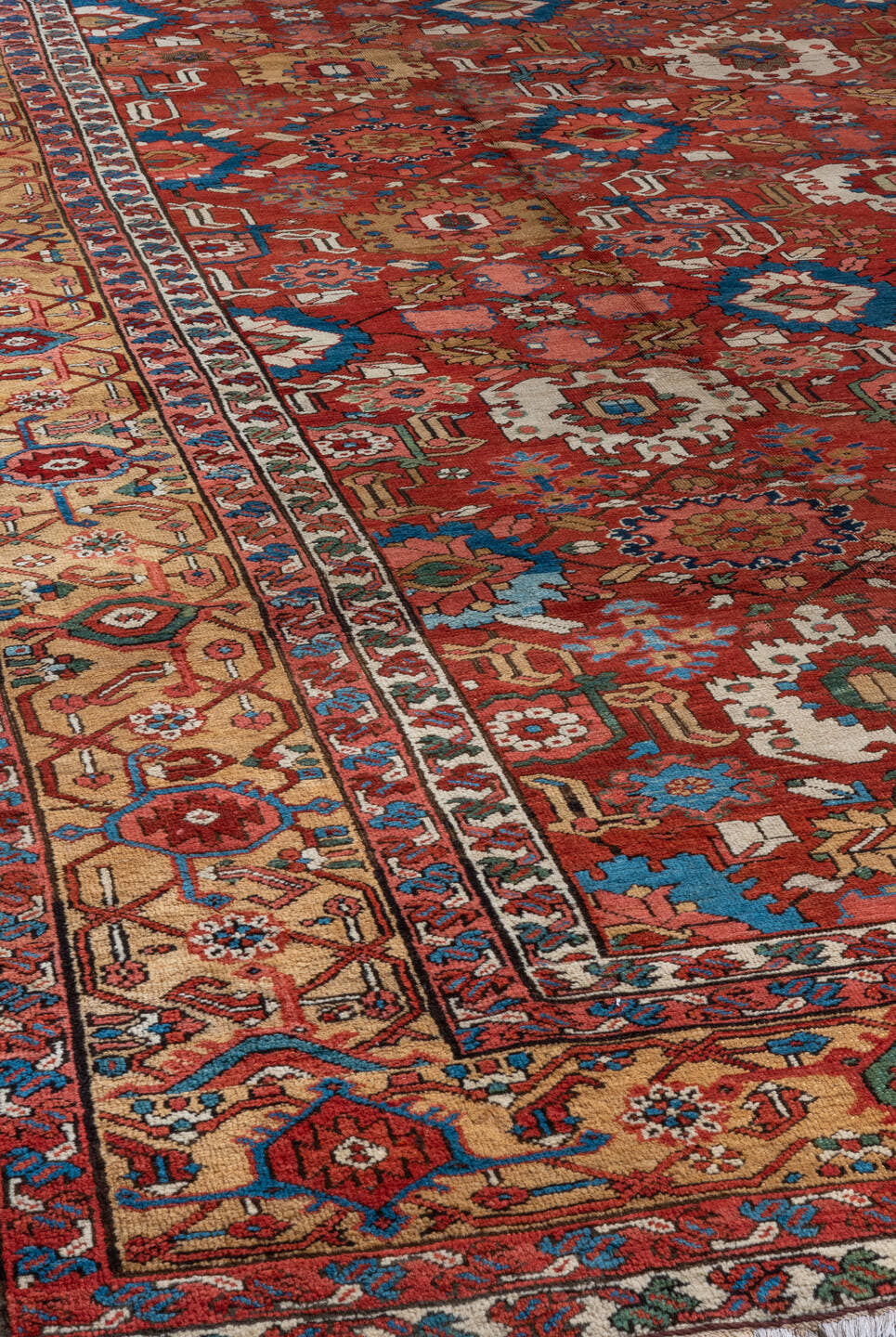 11' x 21' one-of-a-kind handmade antique Serapi oversize rug. Color palette: red, ivory, camel, blue, rose, rust, sage