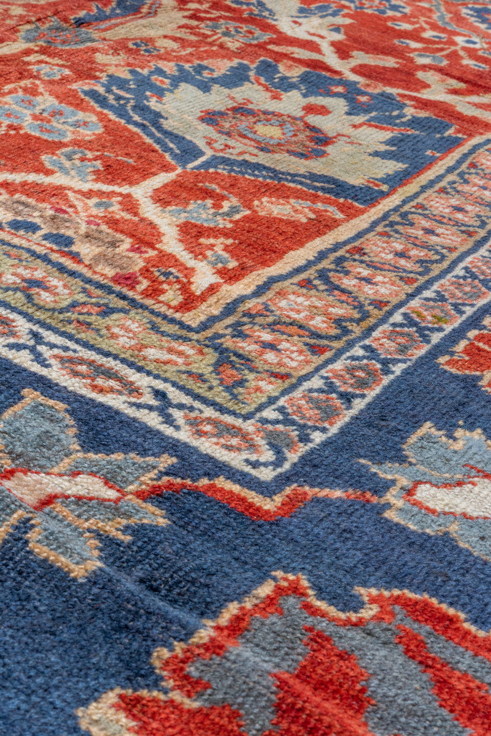 11' x 14' one-of-a-kind handmade vintage Sultanabad oversize rug. Color palette: rust, navy, ivory, slate, camel, crimson