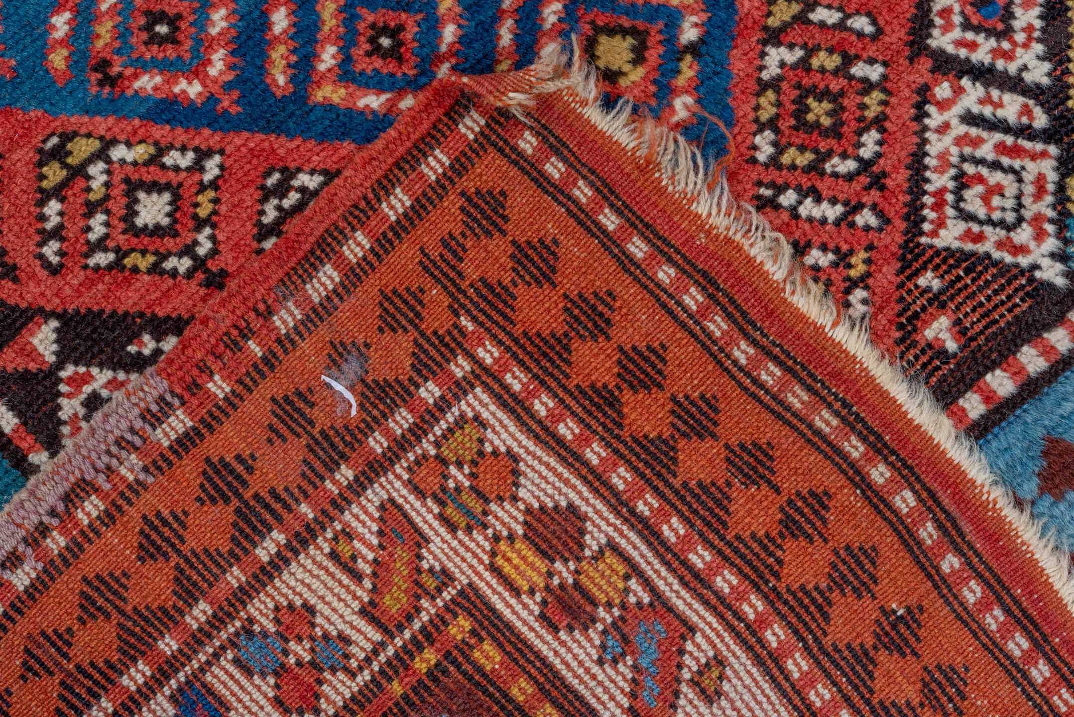 3' x 9' one-of-a-kind handmade vintage Genje runner rug. Color palette: rust, ivory, cobalt, navy, terra cotta, camel