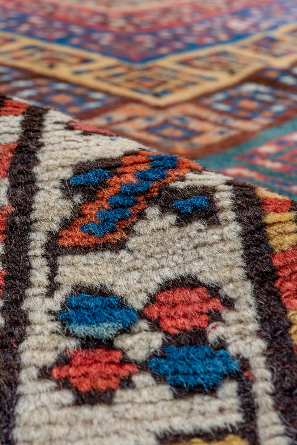 3' x 9' one-of-a-kind handmade vintage Genje runner rug. Color palette: rust, ivory, cobalt, navy, terra cotta, camel