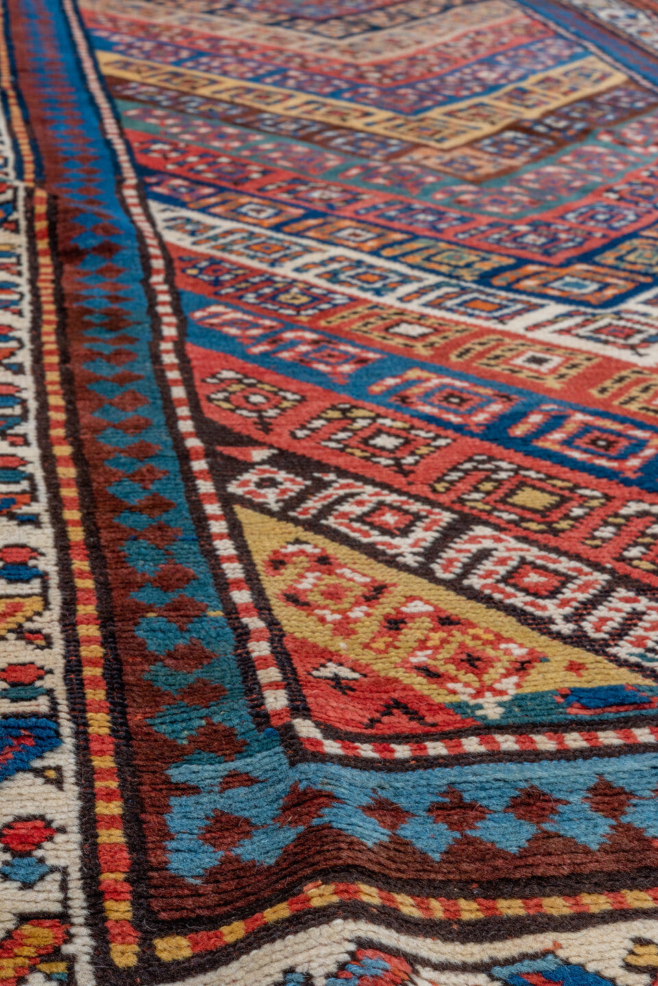 3' x 9' one-of-a-kind handmade vintage Genje runner rug. Color palette: rust, ivory, cobalt, navy, terra cotta, camel