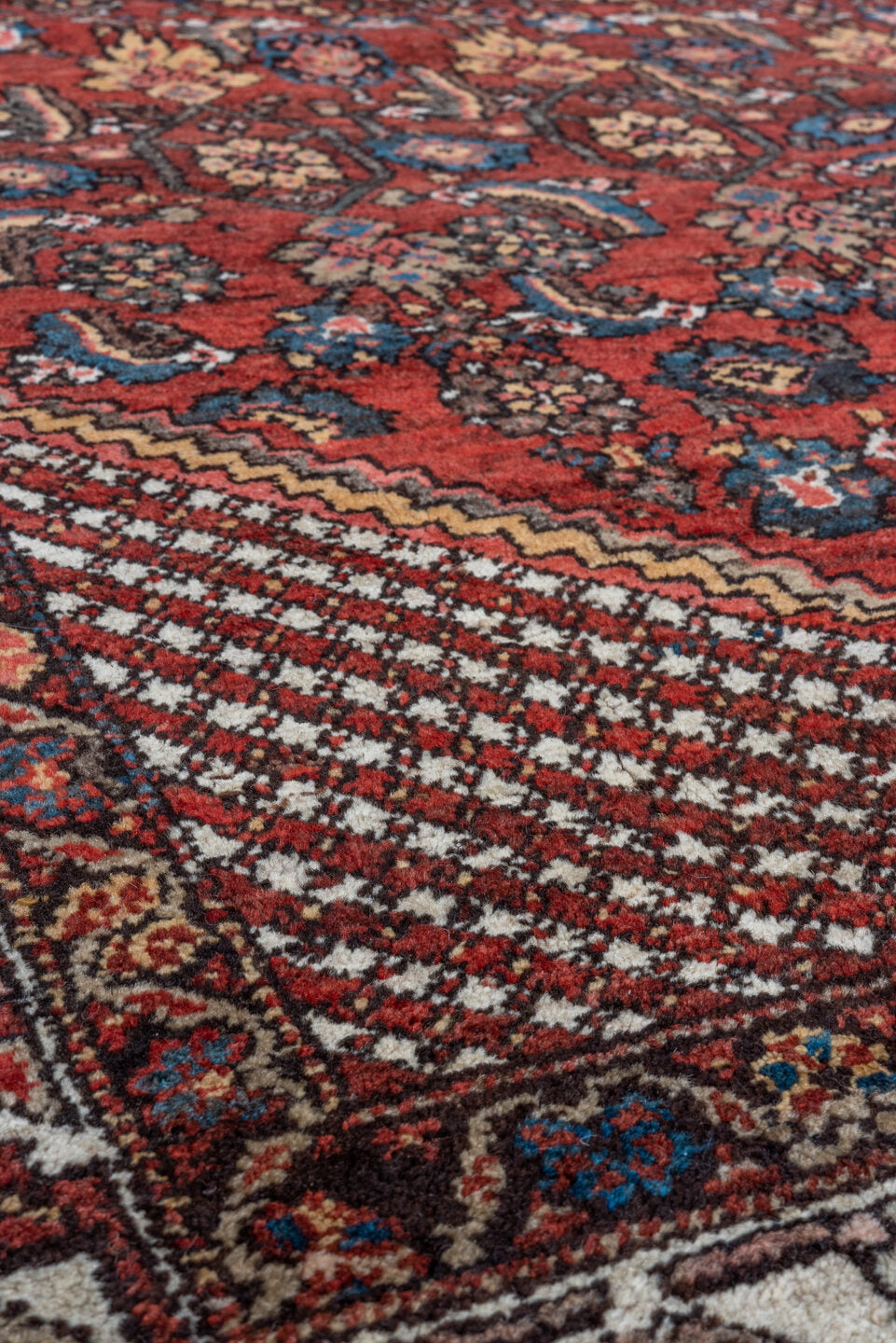 4' x 6' one-of-a-kind handmade vintage Kurd small size rug. Color palette: red, ivory, indigo, rust, navy, camel, burgundy