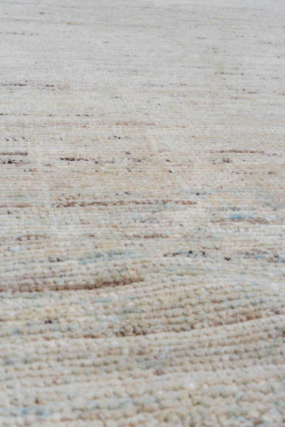 5' x 11' one-of-a-kind handmade vintage Tulu runner rug. Color palette: ivory, pale blue, taupe, gray, cream, light blue