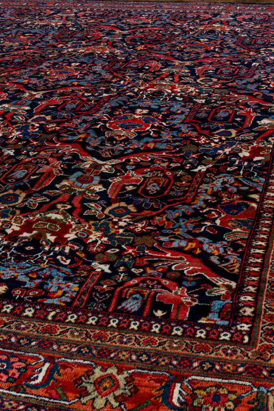 12' x 17' one-of-a-kind handmade vintage Mahal oversize rug. Color palette: navy, rust, crimson, ivory, cobalt, charcoal