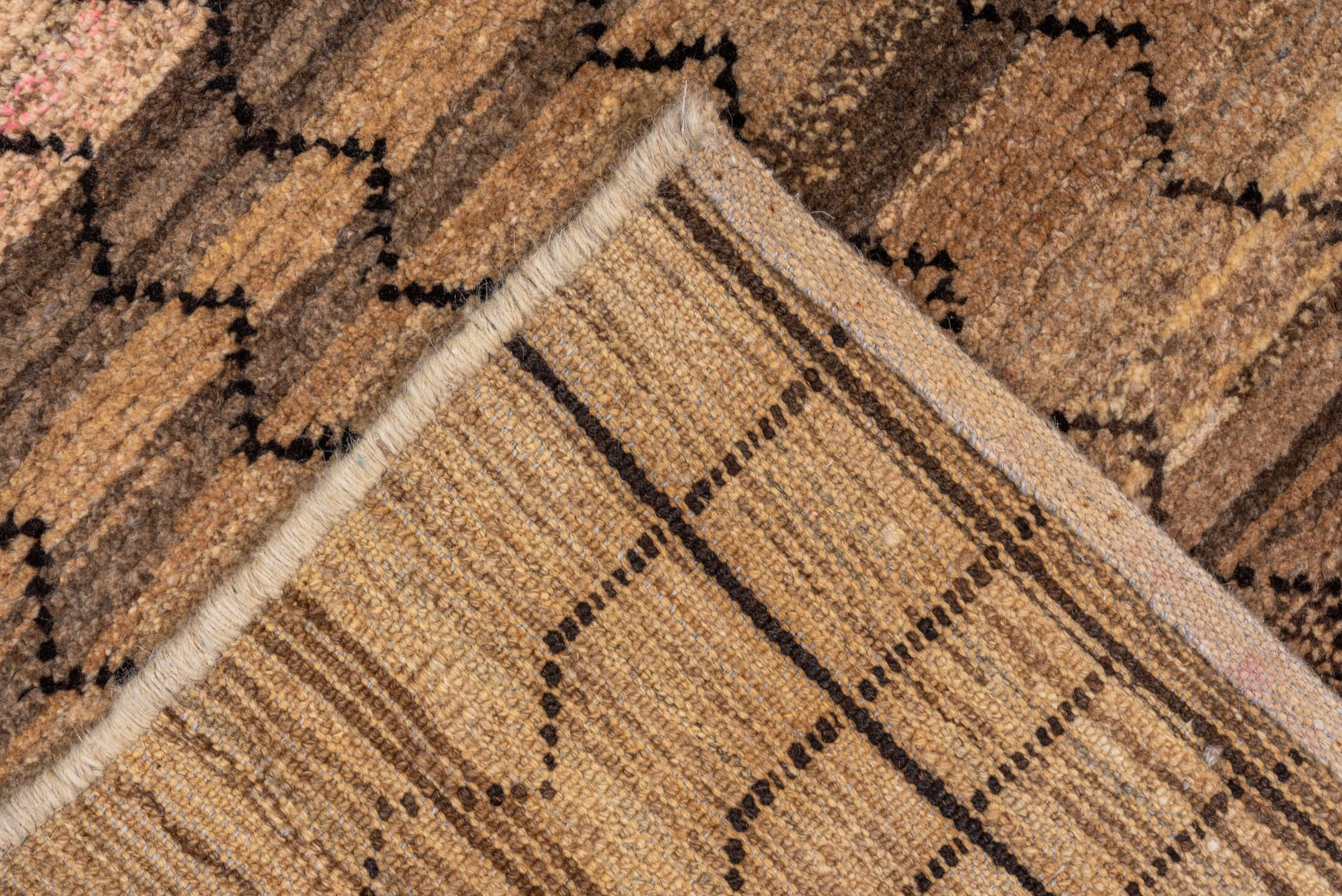 8' x 9' one-of-a-kind handmade vintage Tulu rug. Color palette: black, brown, gray, off-white, orange, pink, snow, white