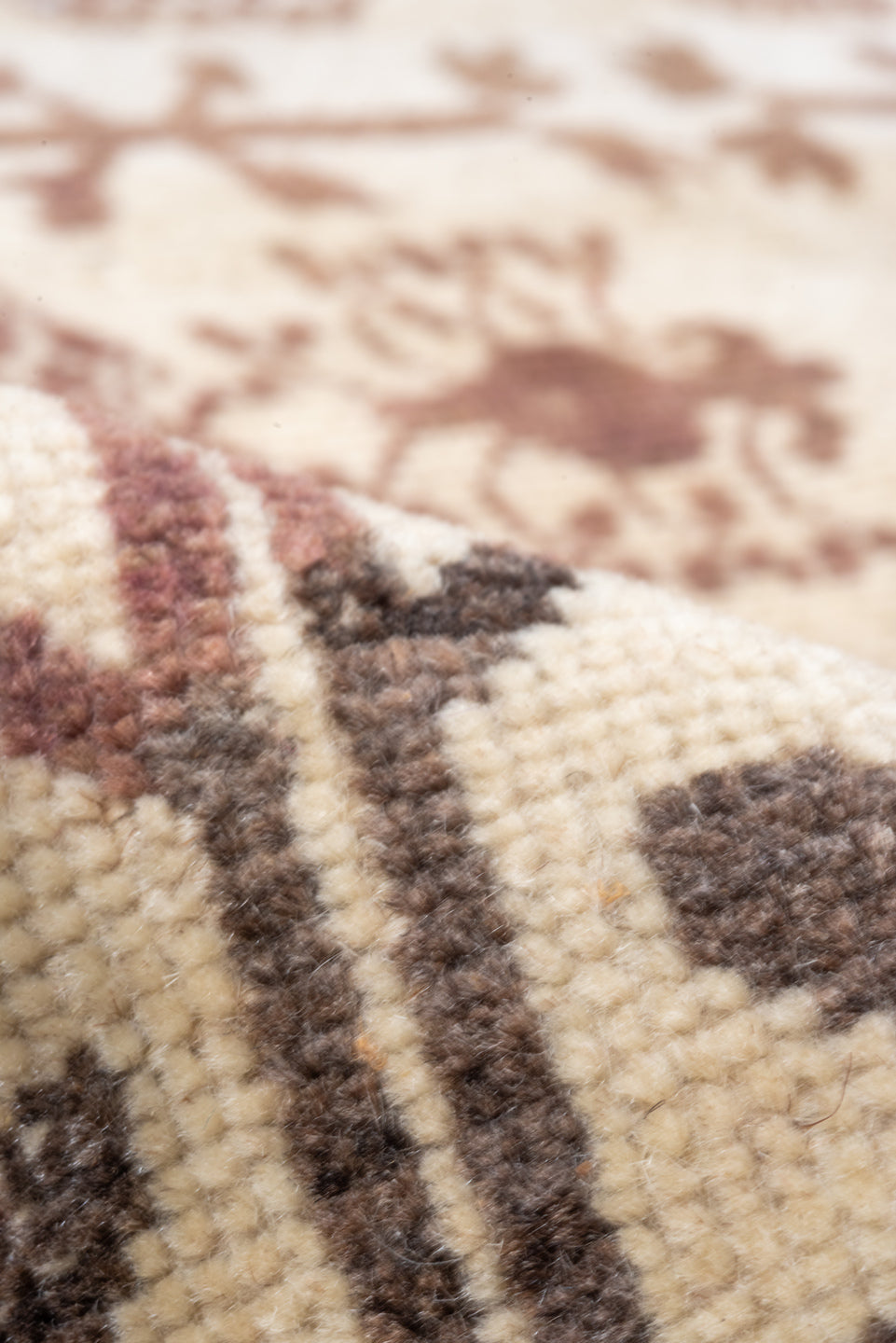 5' x 7' one-of-a-kind handmade vintage Tulu rug. Color palette: brown, gray, light gray, off-white, orange, pink