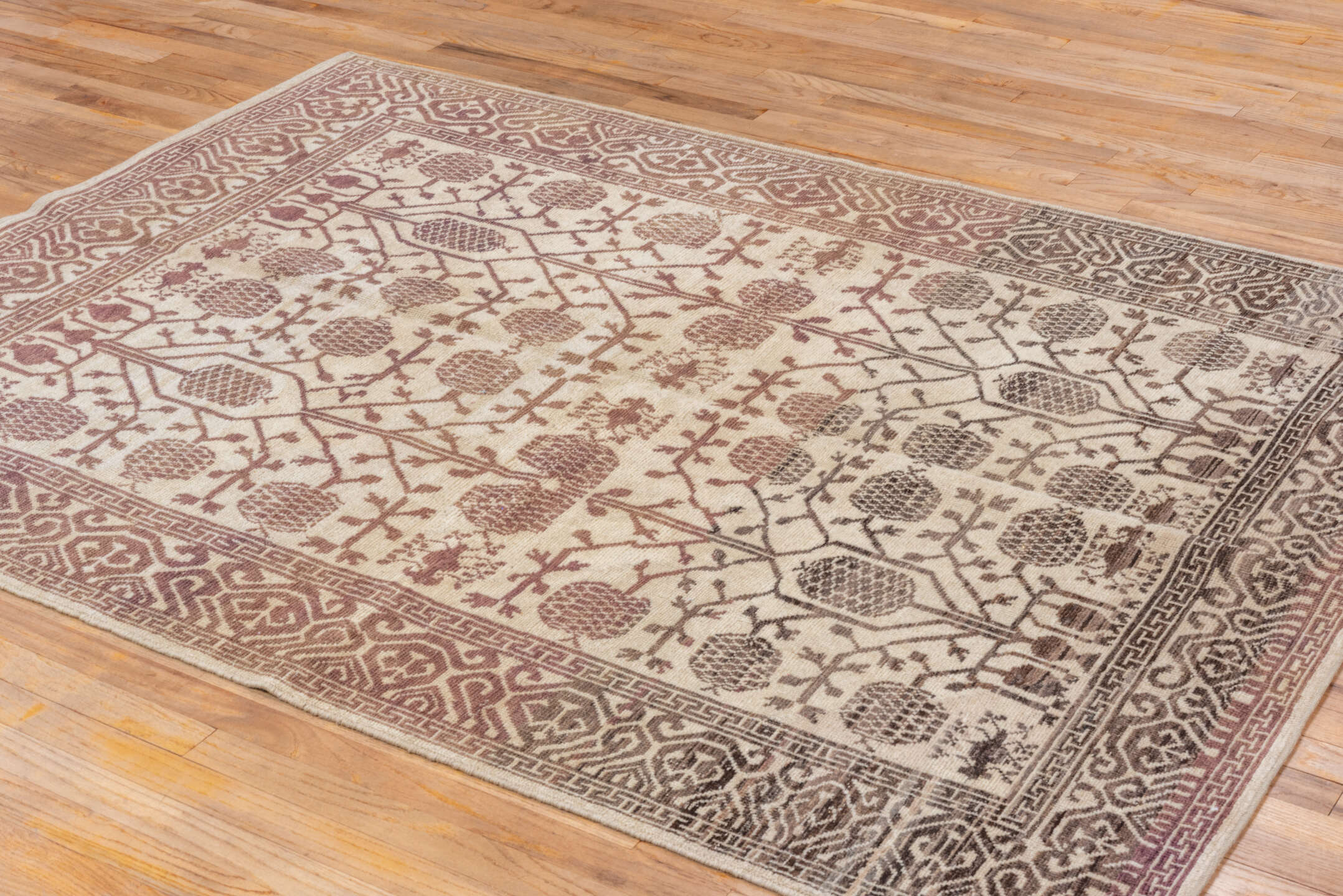 5' x 7' one-of-a-kind handmade vintage Tulu rug. Color palette: brown, gray, light gray, off-white, orange, pink