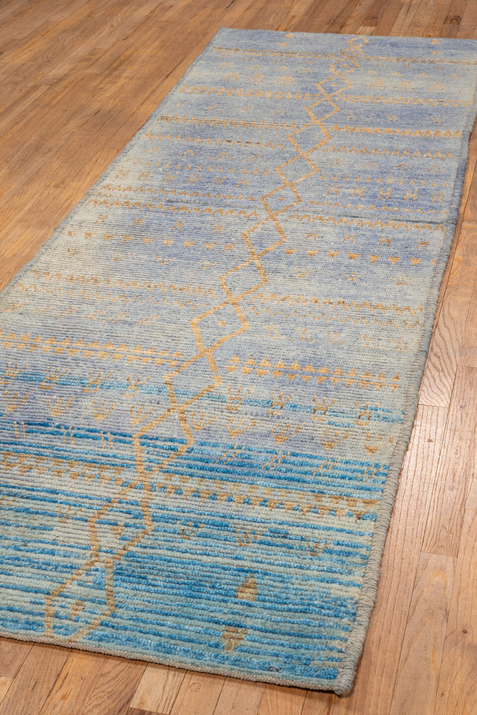 3' x 9' one-of-a-kind handmade vintage Tulu runner rug. Color palette: blue, brown, dark gray, gray, light blue, light gray