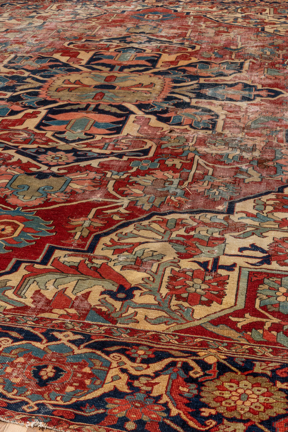 12' x 16' one-of-a-kind handmade vintage Serapi oversize rug. Color palette: red, navy, ivory, rust, sky blue, sage, camel