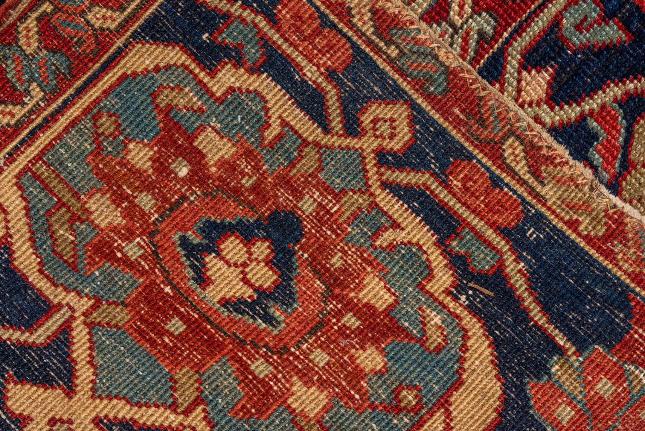 12' x 16' one-of-a-kind handmade vintage Serapi oversize rug. Color palette: red, navy, ivory, rust, sky blue, sage, camel