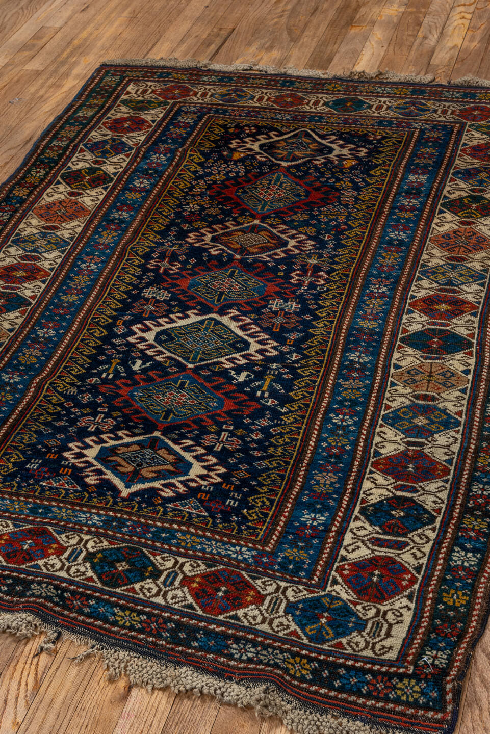 3' x 5' one-of-a-kind handmade vintage Shirvan small size rug. Color palette: navy, ivory, cobalt, crimson, rust, camel