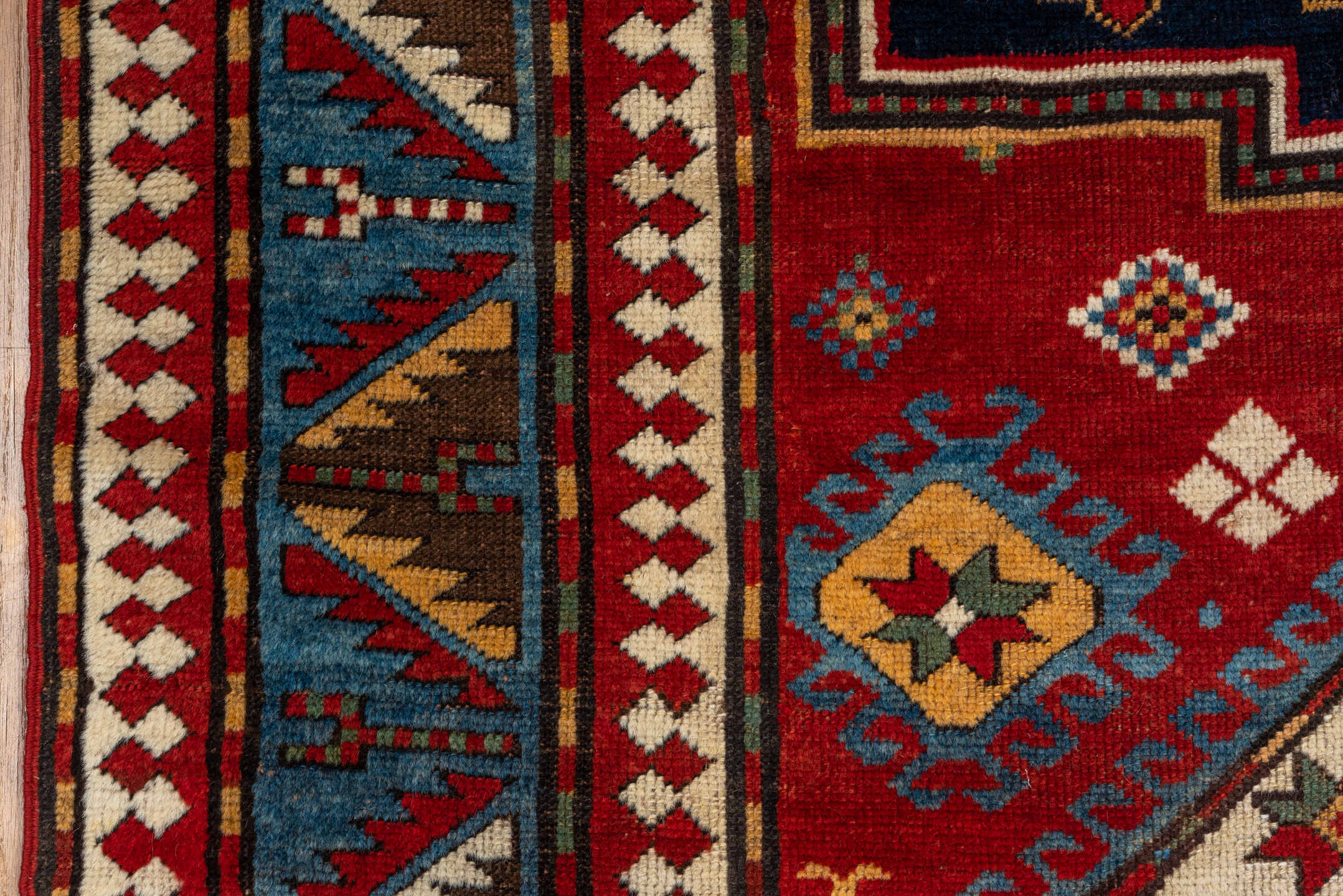 5' x 7' one-of-a-kind handmade vintage Kazak rug. Color palette: blue, brown, fiord, gray, light gray, pink, red, slate gray