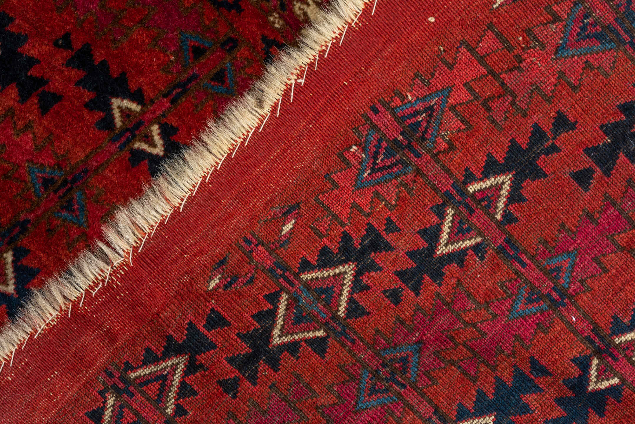 2' x 4' one-of-a-kind handmade vintage Teke small size rug. Color palette: red, burgundy, ivory, navy, rose, brown, black