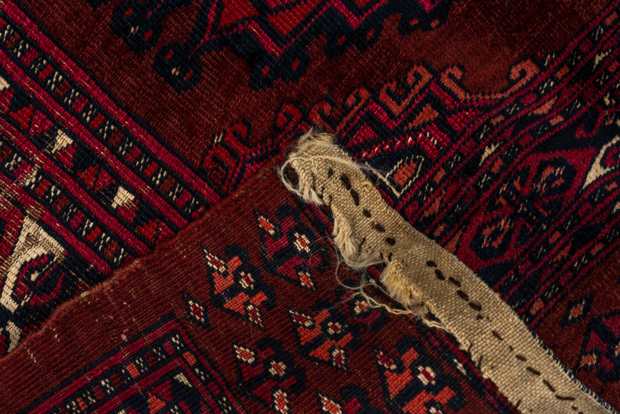 2' x 5' one-of-a-kind handmade vintage Teke small size rug. Color palette: burgundy, crimson, rust, ivory, charcoal, rose