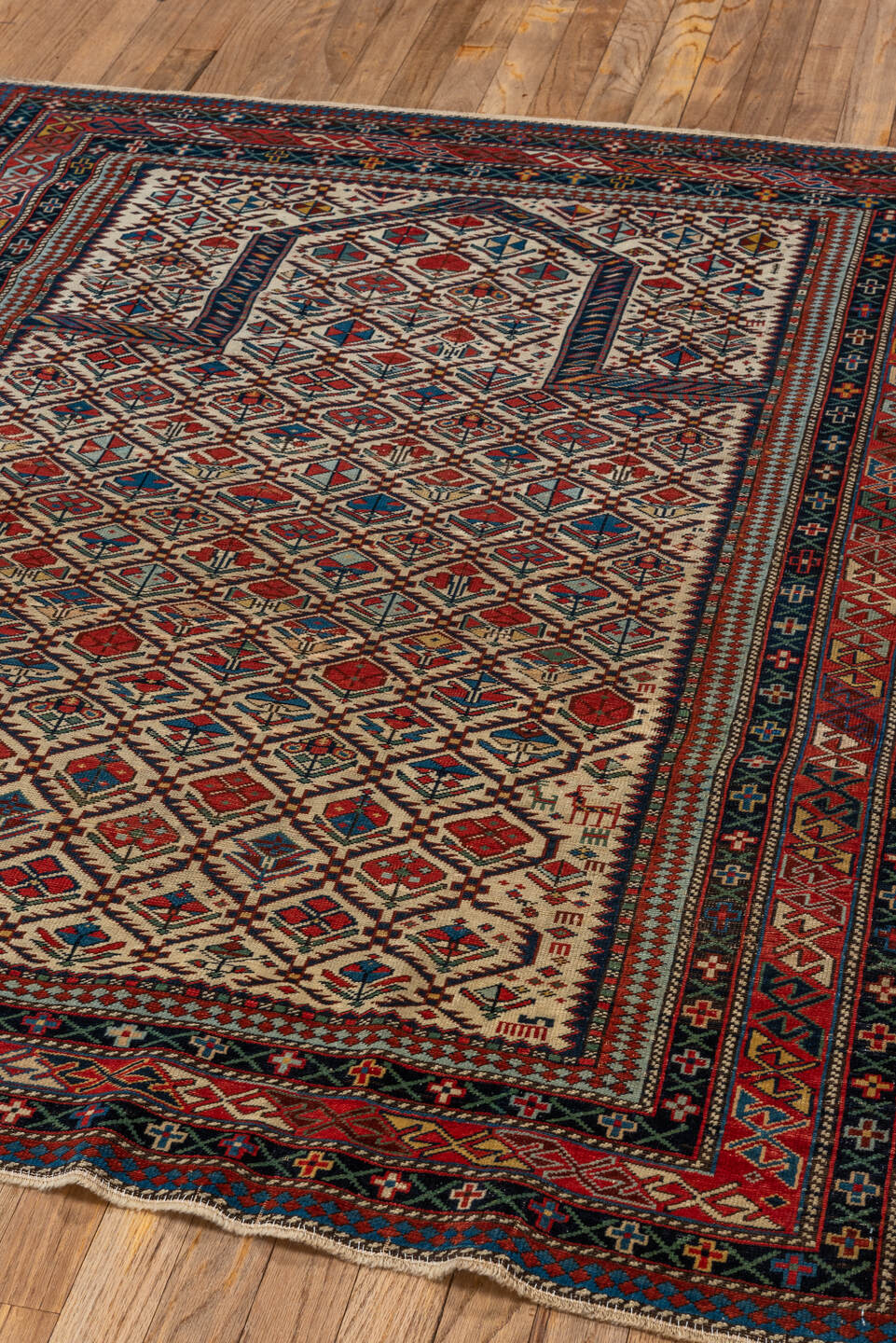 4' x 4' one-of-a-kind handmade vintage Shirvan small size rug. Color palette: ivory, navy, rust, sky blue, crimson, camel