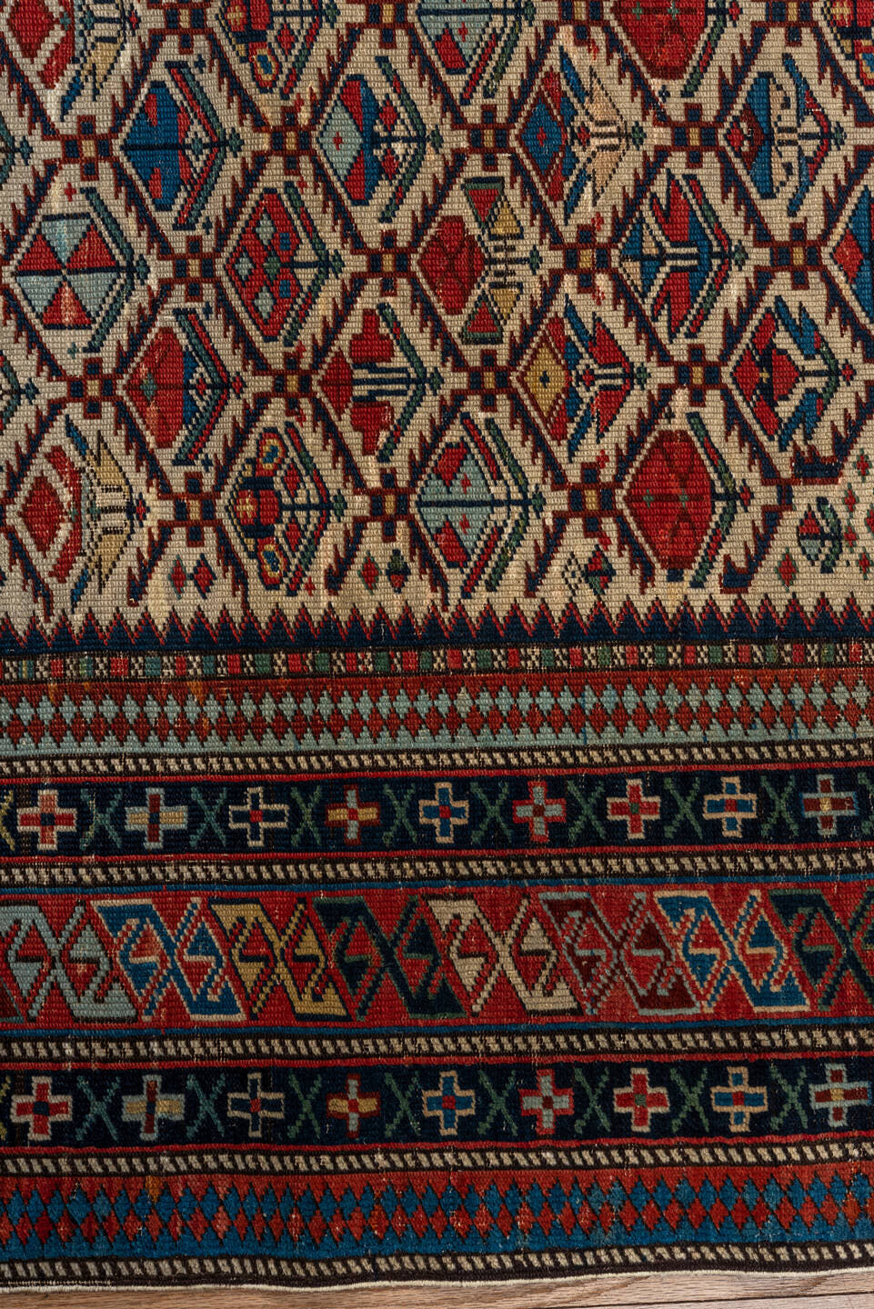 4' x 4' one-of-a-kind handmade vintage Shirvan small size rug. Color palette: ivory, navy, rust, sky blue, crimson, camel
