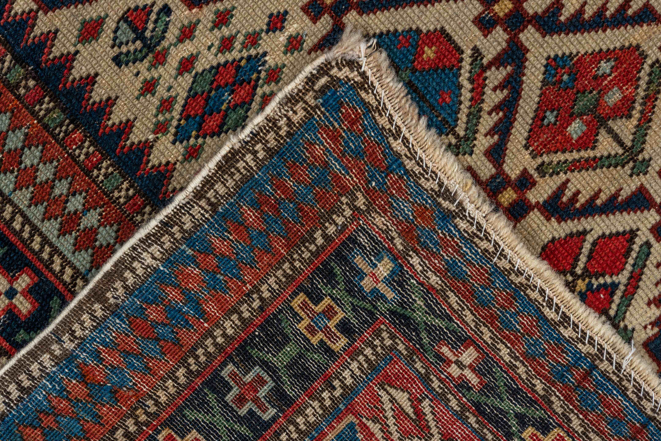 4' x 4' one-of-a-kind handmade vintage Shirvan small size rug. Color palette: ivory, navy, rust, sky blue, crimson, camel