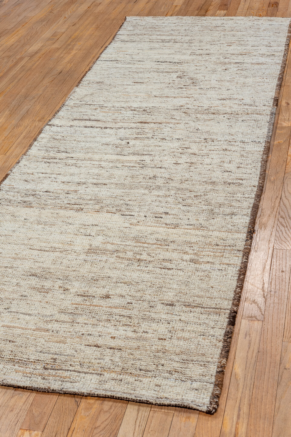 3' x 9' one-of-a-kind handmade vintage Tulu runner rug. Color palette: brown, gray, light gray, off-white