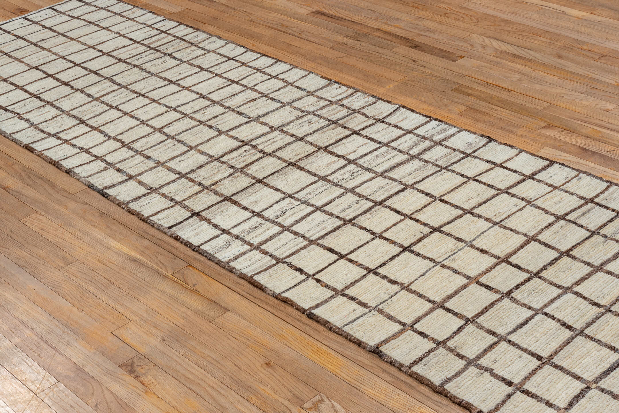 3' x 11' one-of-a-kind handmade vintage Tulu runner rug. Color palette: brown, gray, light gray, off-white, orange, snow