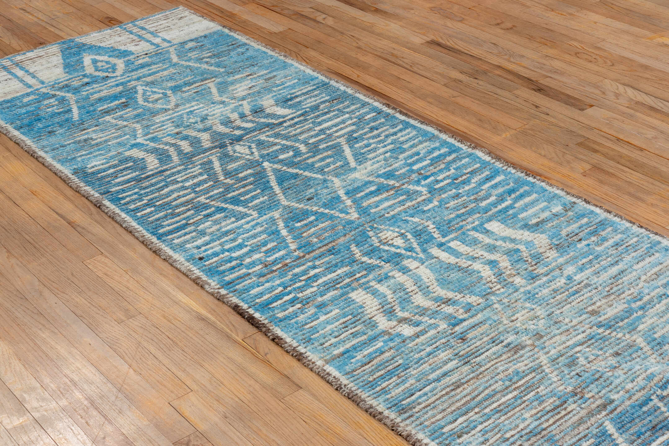3' x 9' one-of-a-kind handmade vintage Tulu runner rug. Color palette: sky blue, ivory, taupe, brown, light blue, beige
