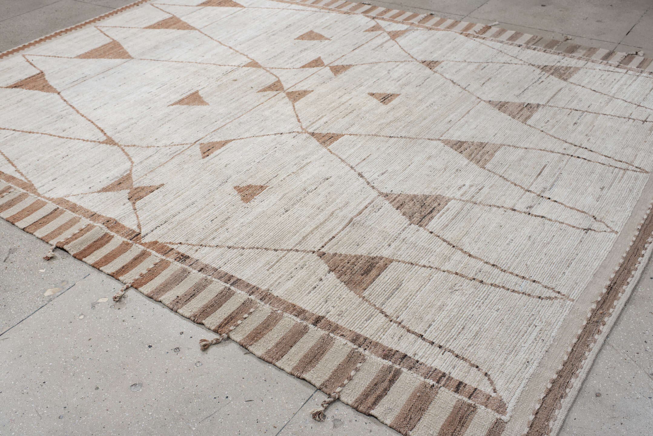 9' x 12' one-of-a-kind handmade vintage Tulu large size rug. Color palette: ivory, camel, taupe, beige, light brown, gray