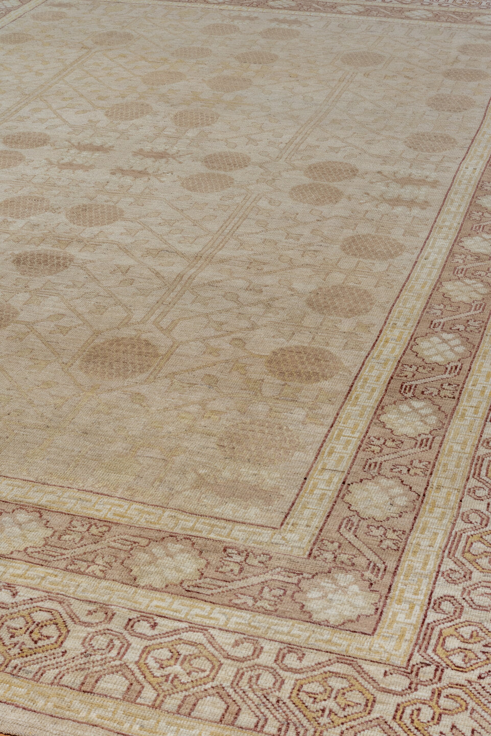 9' x 12' one-of-a-kind handmade vintage Khotan large size rug. Color palette: brown, gray, off-white, orange, pink, snow